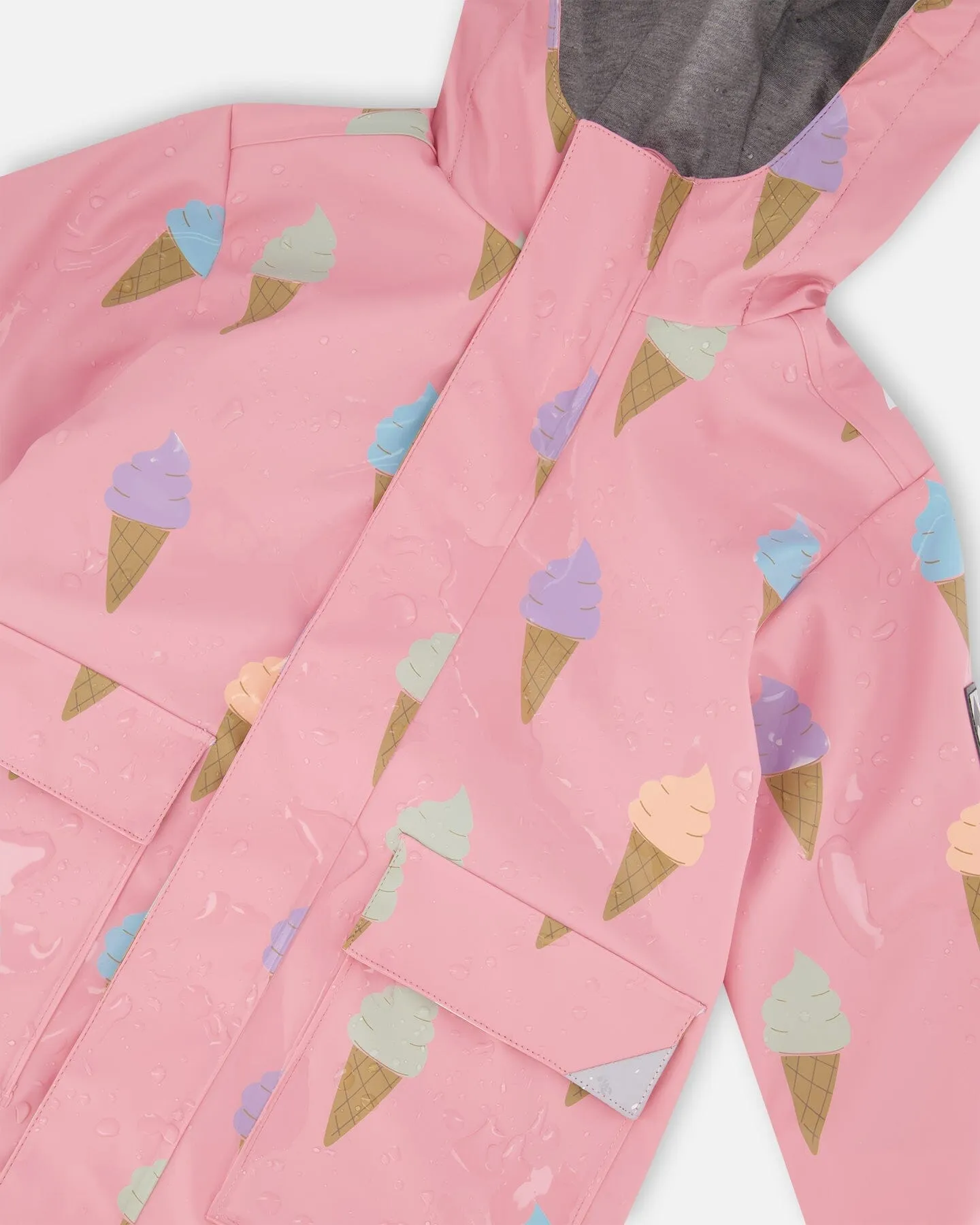 Pink Raincoat With Cones That Change Color Upon Contact With Water